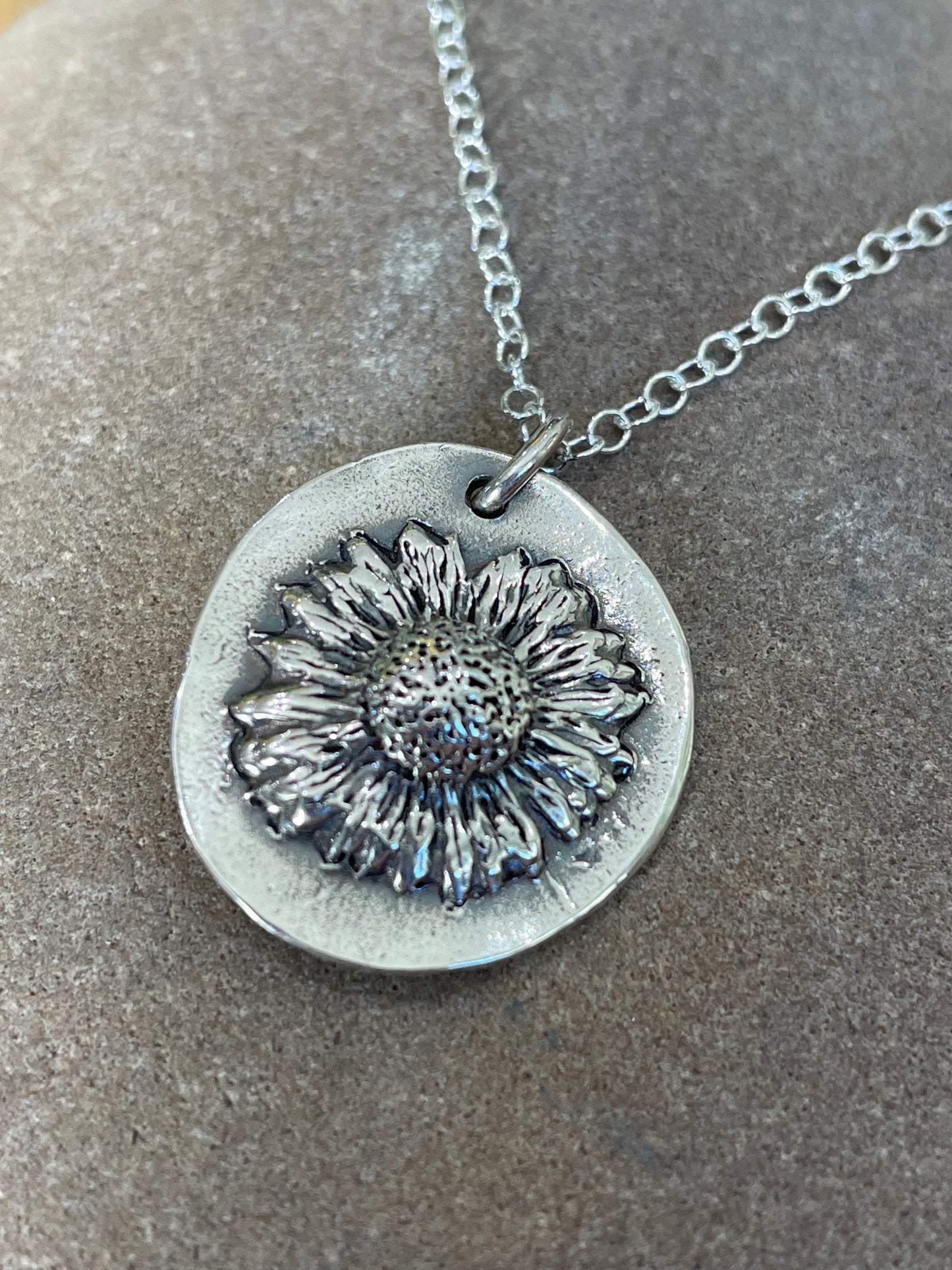 Molly and Me Jewellery Daisy disc pendant close up.