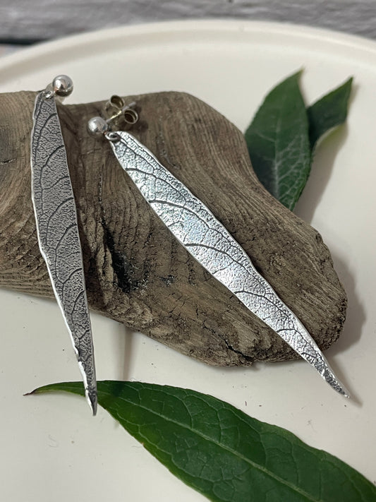 Long silver dangle leaf earrings