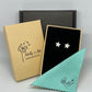 Tiny silver flower stud earrings in branded eco-friendly gift box