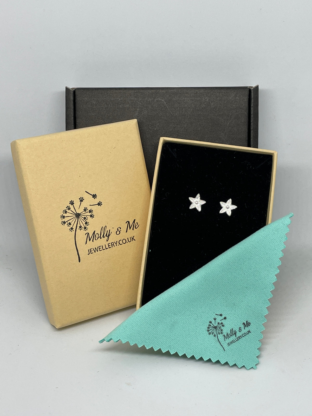 Tiny silver flower stud earrings in branded eco-friendly gift box